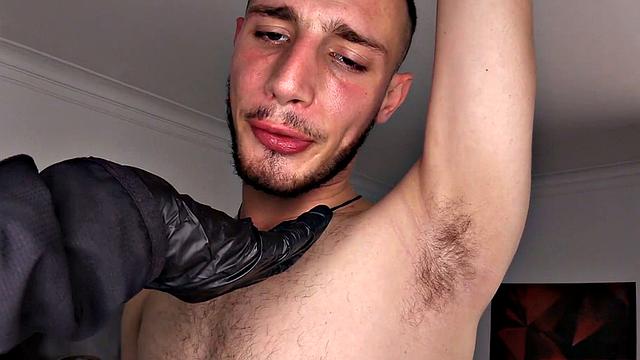 A gloved hand joins Belus in bed, where he is already stripped to his underwear. The hand gropes at his cock and ass, before the horny Latino gets naked. The hand returns to finger and stroke, along with him fucking himself with a big dildo.