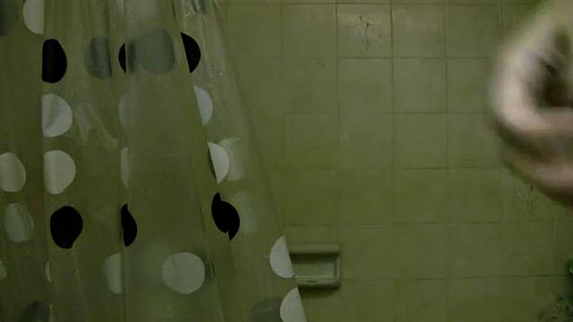 Busty shower teen teases the camera