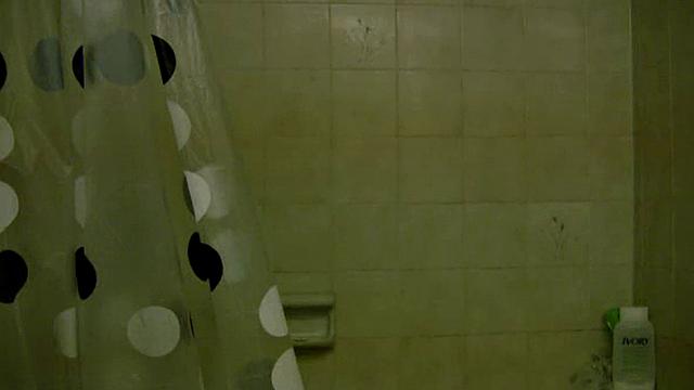 Busty shower teen teases the camera