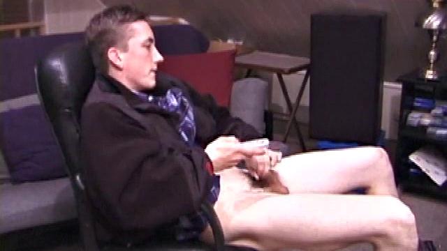 When Derek pulls down the pants his hard cock pops out and he begins stroking it. He obviously enjoys the porn video playing, because Derek soon pumps his warm cum onto his belly.