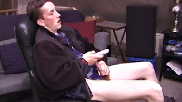 When Derek pulls down the pants his hard cock pops out and he begins stroking it. He obviously enjoys the porn video playing, because Derek soon pumps his warm cum onto his belly.