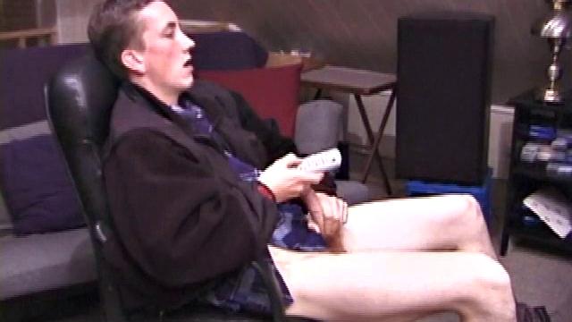 When Derek pulls down the pants his hard cock pops out and he begins stroking it. He obviously enjoys the porn video playing, because Derek soon pumps his warm cum onto his belly.