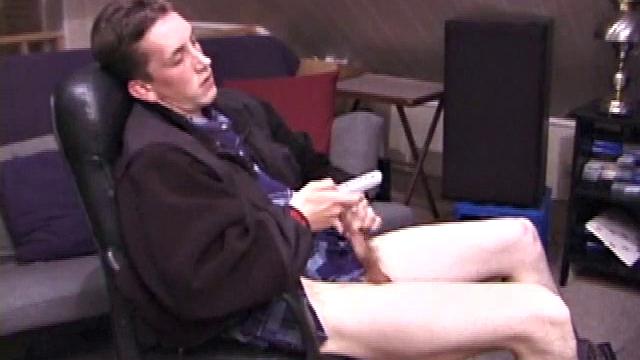 When Derek pulls down the pants his hard cock pops out and he begins stroking it. He obviously enjoys the porn video playing, because Derek soon pumps his warm cum onto his belly.