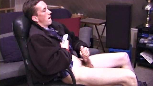 When Derek pulls down the pants his hard cock pops out and he begins stroking it. He obviously enjoys the porn video playing, because Derek soon pumps his warm cum onto his belly.