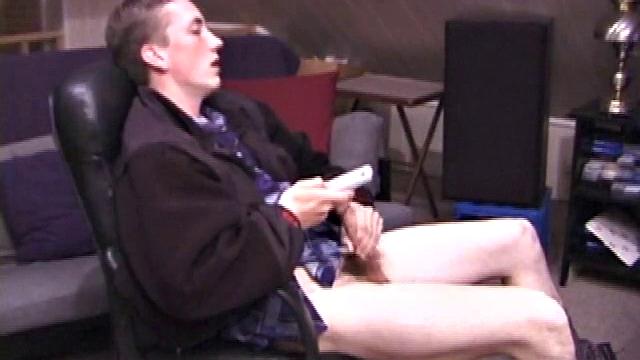 When Derek pulls down the pants his hard cock pops out and he begins stroking it. He obviously enjoys the porn video playing, because Derek soon pumps his warm cum onto his belly.