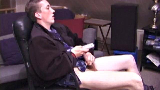 When Derek pulls down the pants his hard cock pops out and he begins stroking it. He obviously enjoys the porn video playing, because Derek soon pumps his warm cum onto his belly.