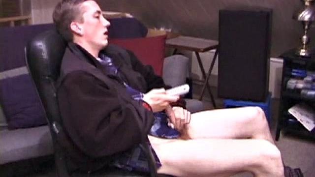 When Derek pulls down the pants his hard cock pops out and he begins stroking it. He obviously enjoys the porn video playing, because Derek soon pumps his warm cum onto his belly.