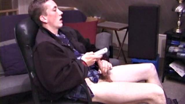 When Derek pulls down the pants his hard cock pops out and he begins stroking it. He obviously enjoys the porn video playing, because Derek soon pumps his warm cum onto his belly.