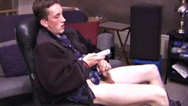 When Derek pulls down the pants his hard cock pops out and he begins stroking it. He obviously enjoys the porn video playing, because Derek soon pumps his warm cum onto his belly.