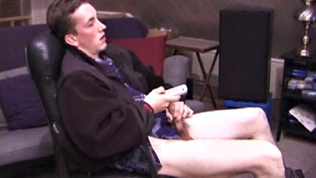 When Derek pulls down the pants his hard cock pops out and he begins stroking it. He obviously enjoys the porn video playing, because Derek soon pumps his warm cum onto his belly.