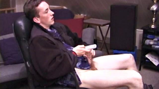 When Derek pulls down the pants his hard cock pops out and he begins stroking it. He obviously enjoys the porn video playing, because Derek soon pumps his warm cum onto his belly.