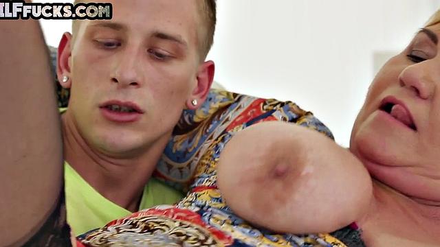 Busty cougar in black stockings gets pussyfucked by stud