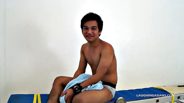 This adorable gay Asian boy is Ronny. He's 19 years old and insanely ticklish. This will be Ronny's introduction to the male tickling world as Ricky has him strapped down for some kinky fun.
