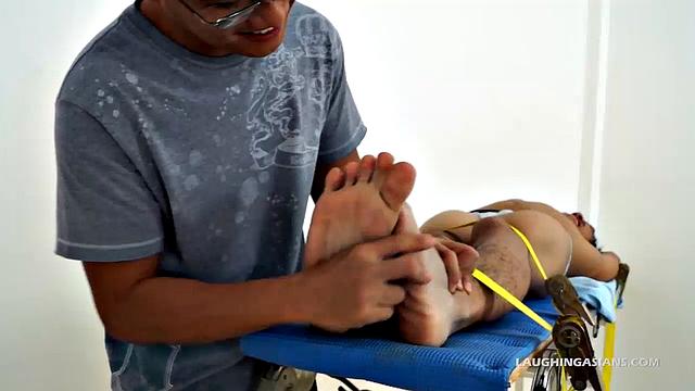 This adorable gay Asian boy is Ronny. He's 19 years old and insanely ticklish. This will be Ronny's introduction to the male tickling world as Ricky has him strapped down for some kinky fun.