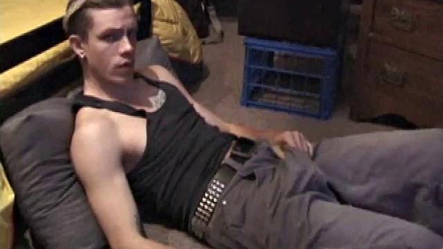 Shane plays with himself until his cock is nice and hard. He pulls down his shorts and briefs to reveal his excited cock.