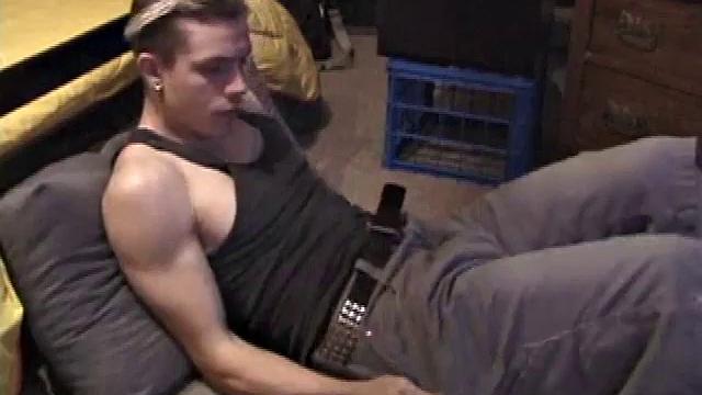 Shane plays with himself until his cock is nice and hard. He pulls down his shorts and briefs to reveal his excited cock.