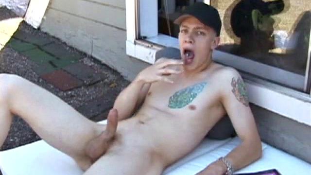 We find Shane enjoying a beautiful day, oblivious to the sounds of traffic on the streets below. Soon he unbuckles and unzips, letting his eager boner poke out.