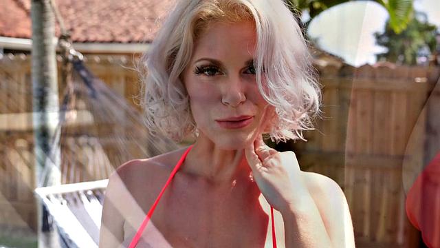 Big tits, in a bikini and lots of oil