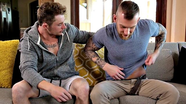Tattooed stud with a huge cock gives a rimming and deepthroats BF in the living room
