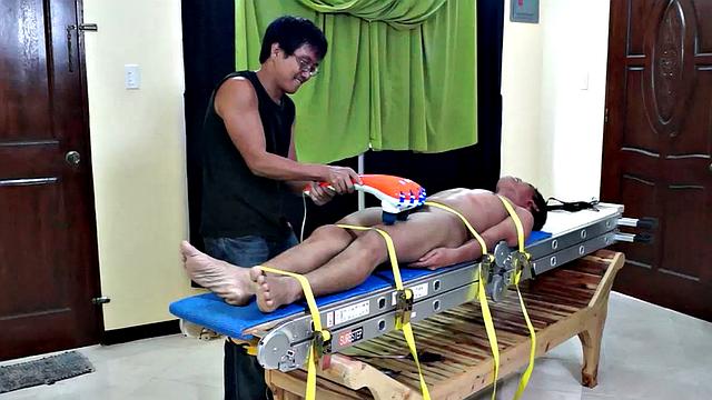This giggly tickly Asian boy had some real ticklish feet. The feathers seemed to drive him crazy, so when we hit him, he went nuts!