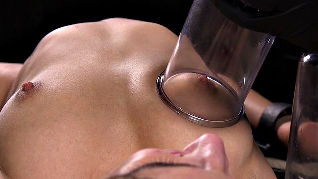 Bound bdsm sub getting toyed after suction cups treatment