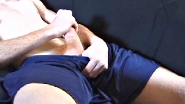 Tristan wastes time getting his dick out of his pants. He watches a porn video, pulling on his growing cock. Once boned up, he strokes with determination and explodes a gusher of warm cum.