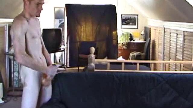 Tristan wastes time getting his dick out of his pants. He watches a porn video, pulling on his growing cock. Once boned up, he strokes with determination and explodes a gusher of warm cum.