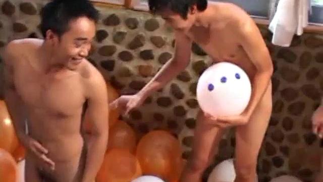 Eight boys play a game of strip balloons where a giant dice determines who undresses