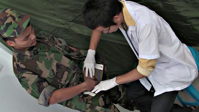 Skinny Asian soldier teased and barebacked by medic