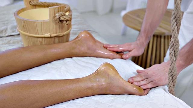 Massaged babe passionately fucked by masseur cock