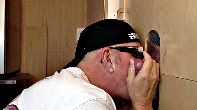 Gray mature amateur giving head to gloryhole cock