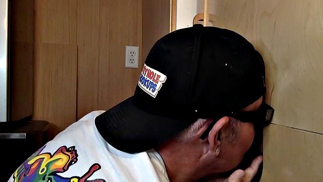 Gray mature amateur giving head to gloryhole cock