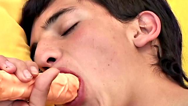 Latin twink Kike is stretched out on a bed, playing with himself while stripping out of his clothes. Once naked and hard, the boy starts beating off.