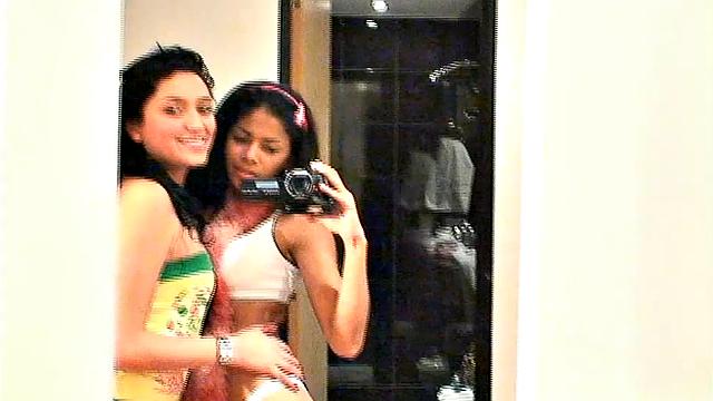 Carina 18 with lesbian babe selfie in front of mirror. They expose tits and get naughty pose