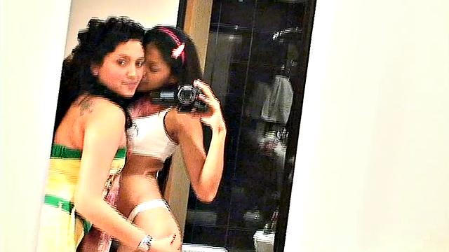 Carina 18 with lesbian babe selfie in front of mirror. They expose tits and get naughty pose