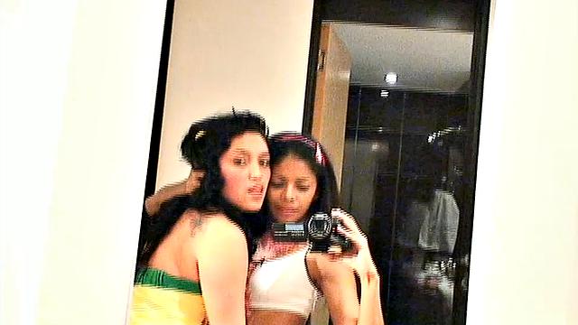 Carina 18 with lesbian babe selfie in front of mirror. They expose tits and get naughty pose