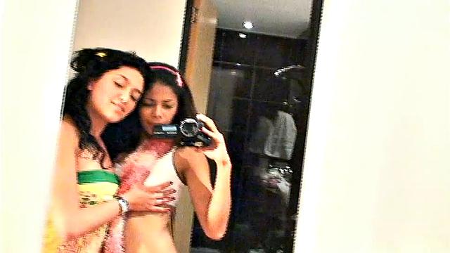Carina 18 with lesbian babe selfie in front of mirror. They expose tits and get naughty pose