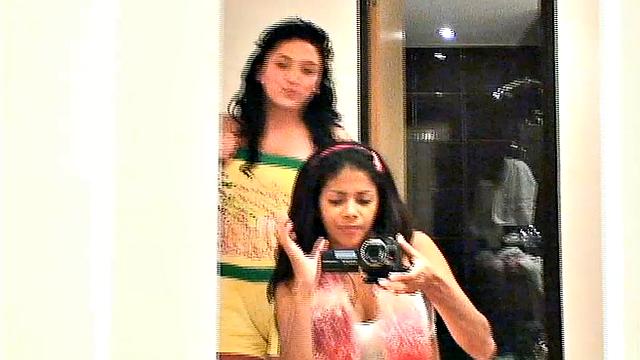 Carina 18 with lesbian babe selfie in front of mirror. They expose tits and get naughty pose