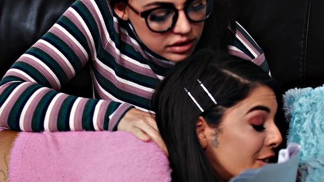 A hot Brazilian babe with glasses and small tits get naughty in jeans and scissoring with her tattooed friend