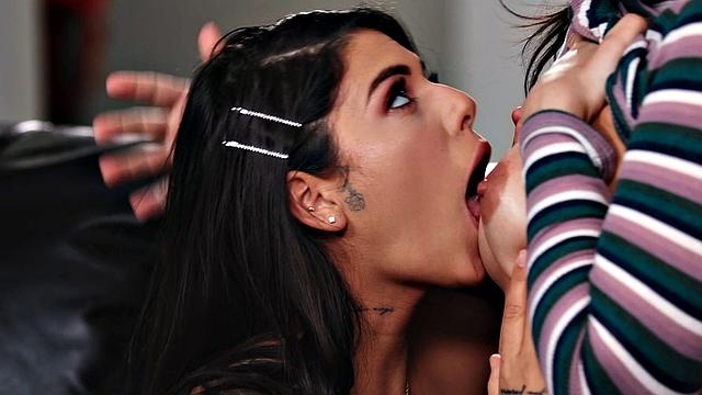 A hot Brazilian babe with glasses and small tits get naughty in jeans and scissoring with her tattooed friend