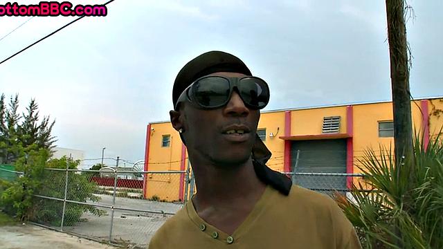 Nubian thug rides cock outdoors next to college bus