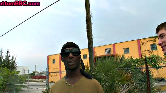 Nubian thug rides cock outdoors next to college bus