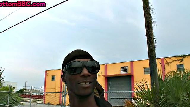 Nubian thug rides cock outdoors next to college bus