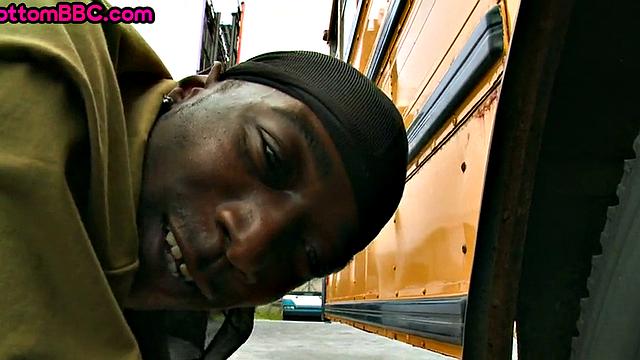 Nubian thug rides cock outdoors next to college bus