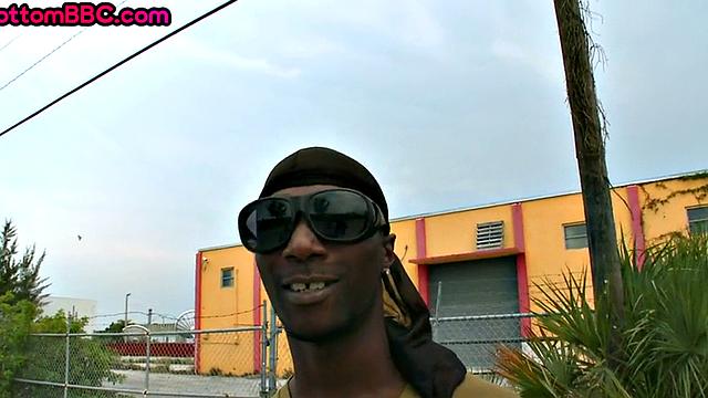 Nubian thug rides cock outdoors next to college bus