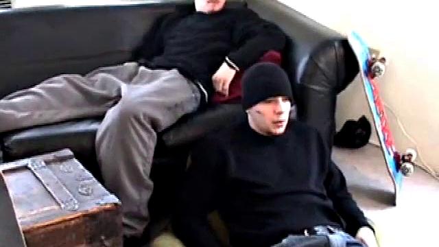 With skateboards propped nearby, and a straight porn video playing, Bradley Shaw is on the floor stroking his fat cock and Ryan Shaw is on the sofa, pants down around his legs, getting a stiff one.