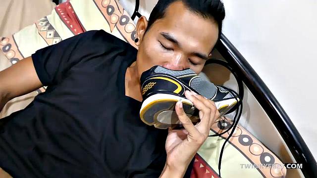 Joshua is a kinky Asian boy who gets off on male feet. He just got home from a long day at work, and nothing turns him on more than the sweet aroma of his Asian boy feet that have spent all day penned up in his shoes.