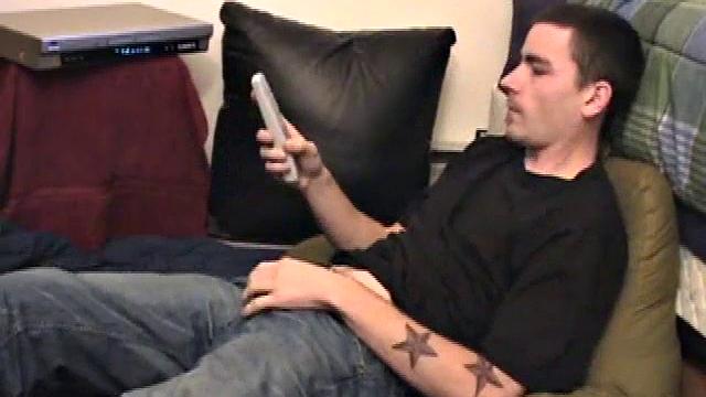 Dan Doe gets comfortable, works up a boner through his pants, gets naked, strokes his hard cock to the porn video, and shoots a high flying wad of warm cum onto his chest.