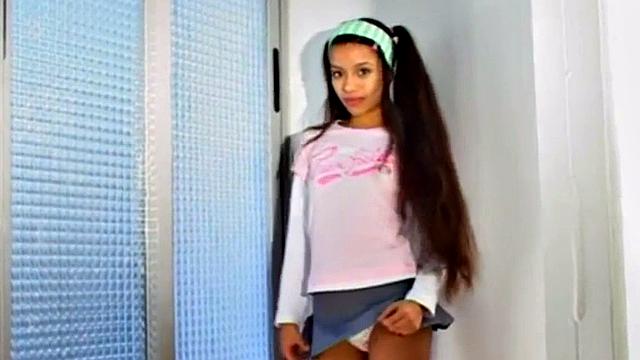 Watch this petite teen with small tits and a skinny frame finger her tight latina pussy solo