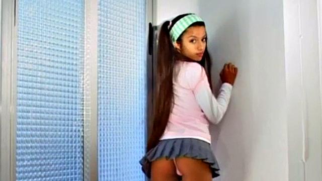 Watch this petite teen with small tits and a skinny frame finger her tight latina pussy solo